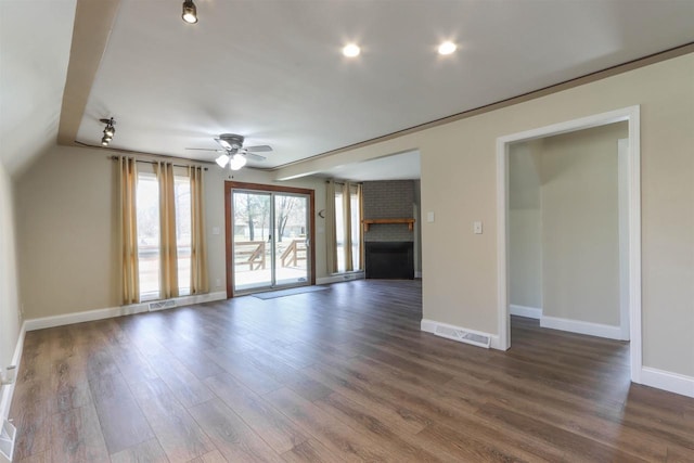 317 Darby Ct, Nekoosa, WI 54457 - unfurnished living room with visible vents, baseboards, ceiling fan, and dark wood-style flooring