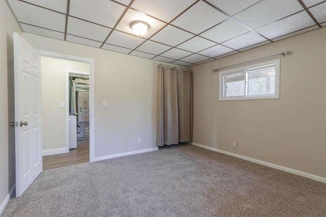 317 Darby Ct, Nekoosa, WI 54457 - carpeted spare room with baseboards and a paneled ceiling
