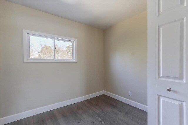 317 Darby Ct, Nekoosa, WI 54457 - spare room featuring dark wood finished floors and baseboards