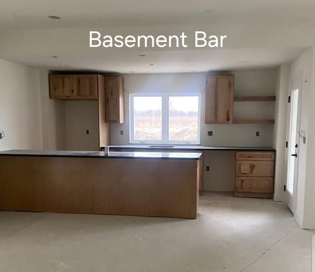 1618 White Deer Trl, Waukesha, WI 53189 - kitchen with open shelves, concrete floors, and brown cabinets