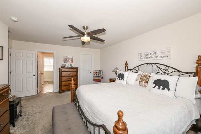 430 Ashley Dr, Williams Bay, WI 53191 - bedroom featuring ensuite bath, ceiling fan, and light carpet