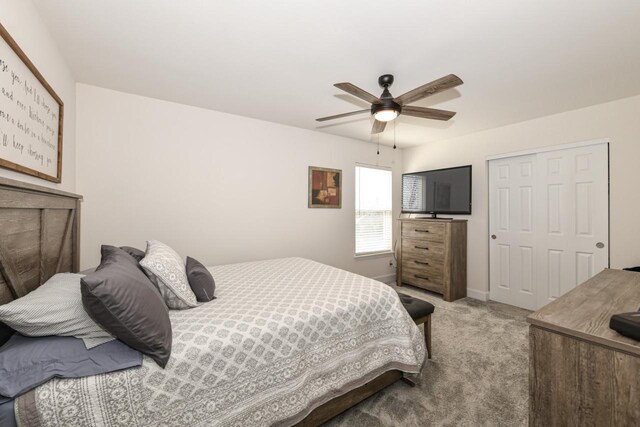 430 Ashley Dr, Williams Bay, WI 53191 - carpeted bedroom featuring a ceiling fan and baseboards