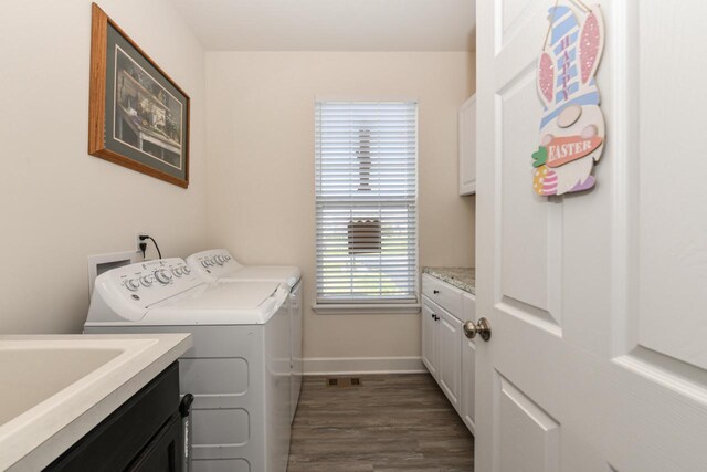 430 Ashley Dr, Williams Bay, WI 53191 - clothes washing area with a sink, separate washer and dryer, cabinet space, baseboards, and dark wood-type flooring