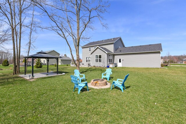 430 Ashley Dr, Williams Bay, WI 53191 - rear view of property with a fire pit, a gazebo, a patio, and a lawn
