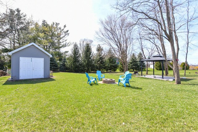 430 Ashley Dr, Williams Bay, WI 53191 - view of yard with a gazebo, an outbuilding, a shed, and an outdoor fire pit