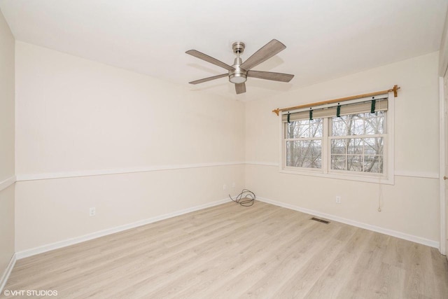 110 W St Unit 1, Lake Geneva, WI 53147 - unfurnished room with visible vents, baseboards, wood finished floors, and ceiling fan