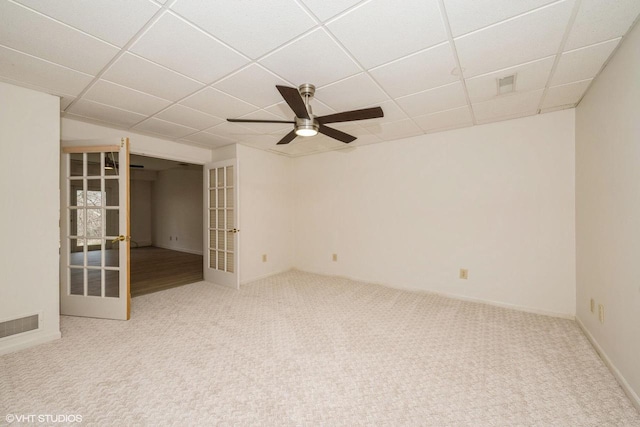 110 W St Unit 1, Lake Geneva, WI 53147 - carpeted empty room with ceiling fan, french doors, a drop ceiling, and visible vents