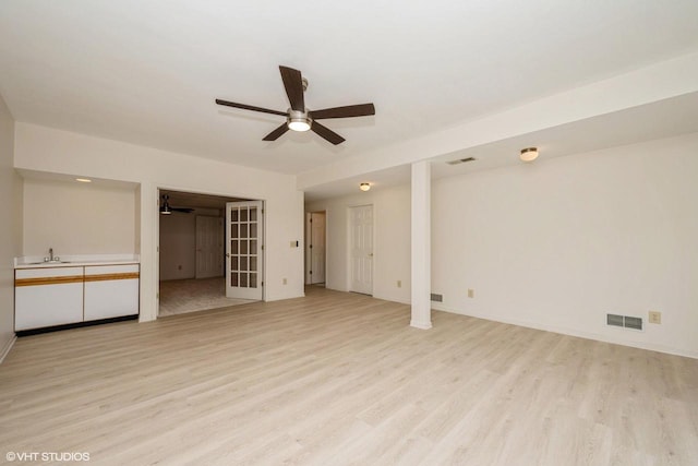 110 W St Unit 1, Lake Geneva, WI 53147 - interior space with light wood-style flooring, visible vents, ceiling fan, and a sink