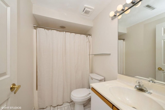 110 W St Unit 1, Lake Geneva, WI 53147 - full bath with toilet, vanity, curtained shower, and visible vents