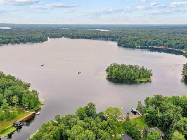 N1220 Otter Ponds Ln, Keshena, WI 54135 - aerial view of a nearby body of water and a heavily wooded area