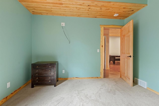 1686 Archer Ave, Nekoosa, WI 54457 - unfurnished bedroom with carpet, wooden ceiling, and baseboards
