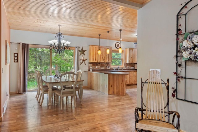 1686 Archer Ave, Nekoosa, WI 54457 - dining room with light wood-style floors, wood ceiling, and a chandelier
