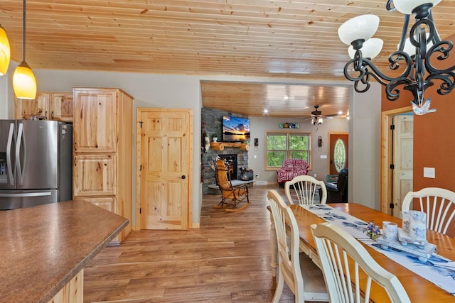 1686 Archer Ave, Nekoosa, WI 54457 - dining room with wooden ceiling, light wood-type flooring, a ceiling fan, and a fireplace