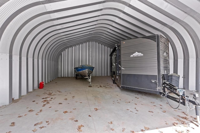1686 Archer Ave, Nekoosa, WI 54457 - miscellaneous room featuring vaulted ceiling and a garage
