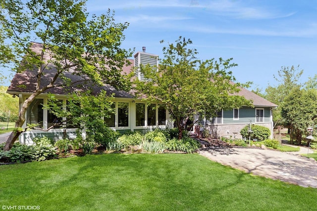 2917 Bridlepath Ct, Lake Geneva, WI 53147 - view of front of house featuring a front lawn and a chimney