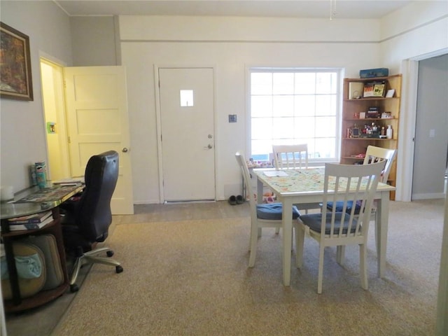 dining space featuring carpet
