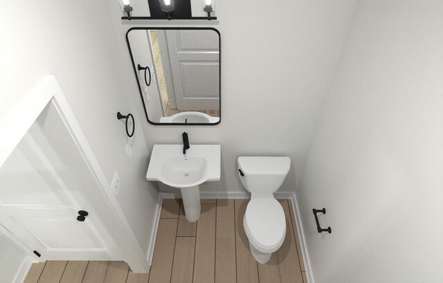 310 Kiddle Ln Unit Lt60, Union Grove, WI 53182 - bathroom with baseboards, wood finished floors, and toilet
