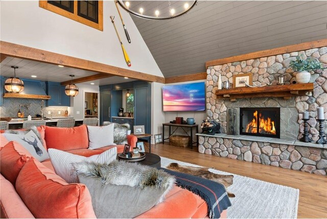 1211 172nd Ave, Balsam Lake, WI 54810 - living room featuring wood finished floors, a fireplace, and high vaulted ceiling