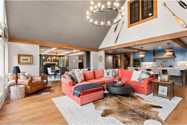 1211 172nd Ave, Balsam Lake, WI 54810 - living room with a chandelier, light wood-style flooring, and high vaulted ceiling
