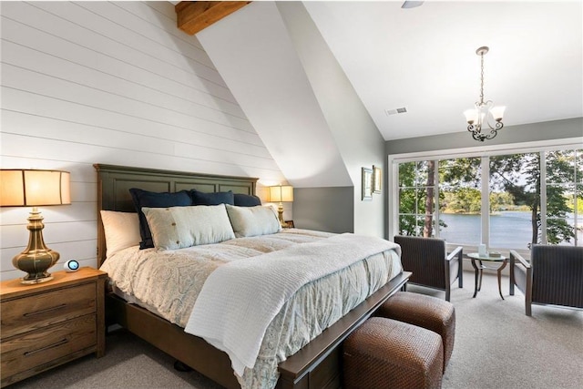 1211 172nd Ave, Balsam Lake, WI 54810 - bedroom with light colored carpet, vaulted ceiling, a chandelier, a water view, and wood walls