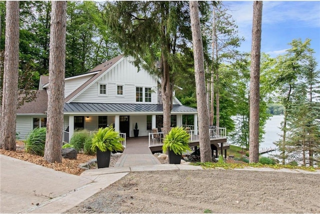 1211 172nd Ave, Balsam Lake, WI 54810 - view of front of property with covered porch, board and batten siding, a standing seam roof, and a metal roof
