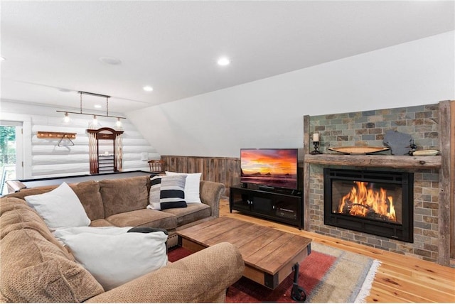 1211 172nd Ave, Balsam Lake, WI 54810 - living area with wood finished floors, wood walls, a brick fireplace, recessed lighting, and a wainscoted wall