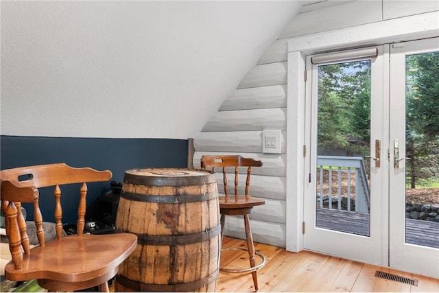 1211 172nd Ave, Balsam Lake, WI 54810 - bar with wood-type flooring, vaulted ceiling, and french doors