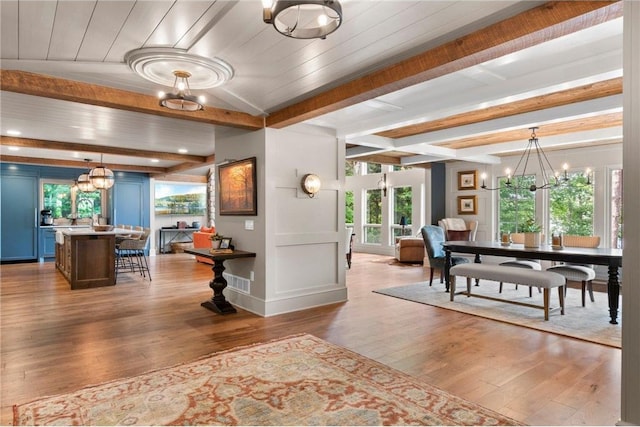 1211 172nd Ave, Balsam Lake, WI 54810 - dining area with a chandelier, wood finished floors, and beamed ceiling