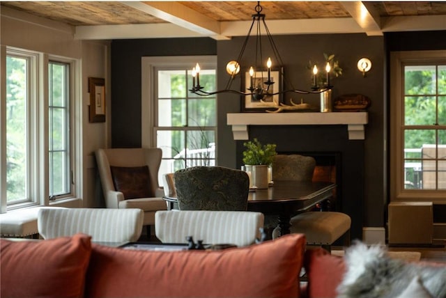 1211 172nd Ave, Balsam Lake, WI 54810 - dining area featuring a chandelier, a large fireplace, and a wood ceiling with exposed beams