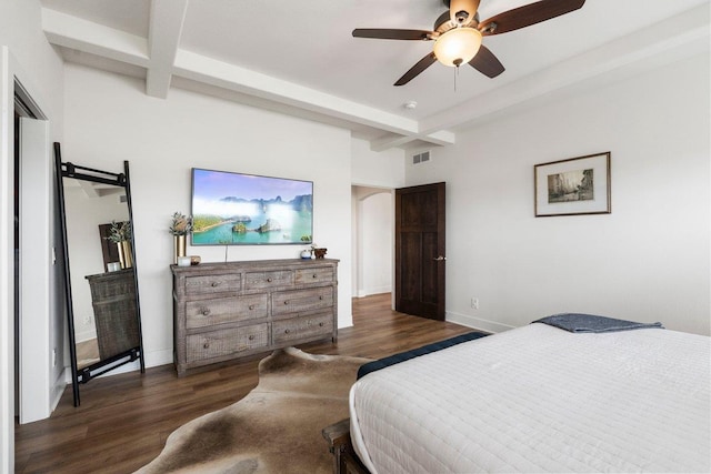 bedroom featuring arched walkways, visible vents, dark wood-type flooring, and beamed ceiling