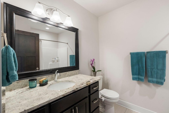 bathroom featuring vanity, toilet, baseboards, and a shower with curtain