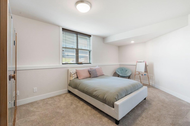 bedroom with baseboards and carpet flooring