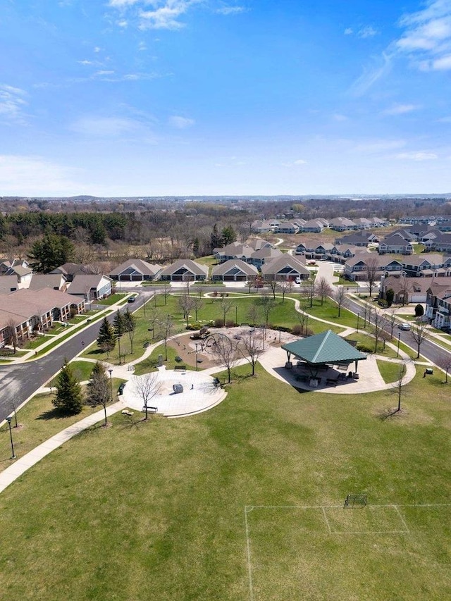 birds eye view of property with a residential view