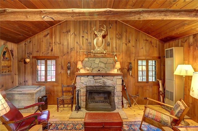 13019W Indian Lake Rd, Hayward, WI 54843 - living area with wood-type flooring, a healthy amount of sunlight, vaulted ceiling with beams, and wood ceiling