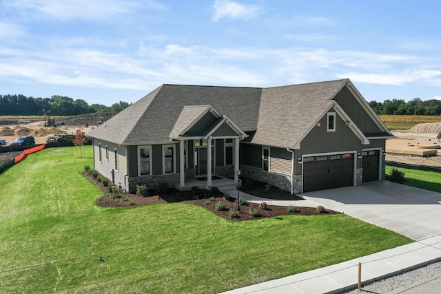 8437 Creek View Ln, Mount Pleasant, WI 53406 - craftsman house featuring roof with shingles, stone siding, concrete driveway, board and batten siding, and a front yard