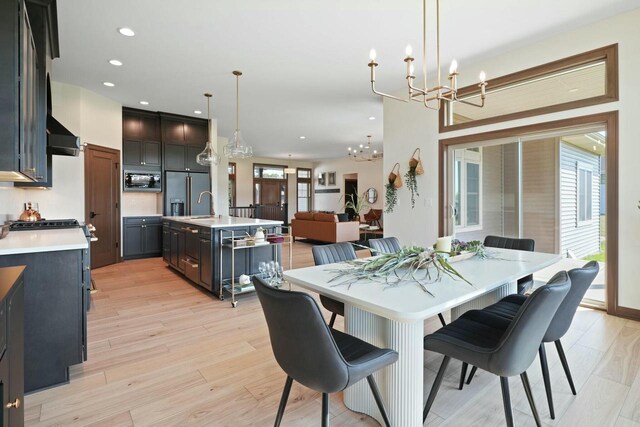 8437 Creek View Ln, Mount Pleasant, WI 53406 - dining area with recessed lighting, light wood finished floors, and a notable chandelier