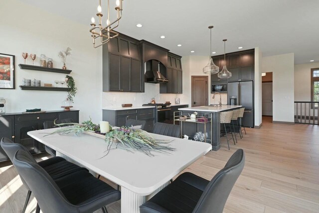 8437 Creek View Ln, Mount Pleasant, WI 53406 - dining space featuring recessed lighting, light wood finished floors, and a notable chandelier