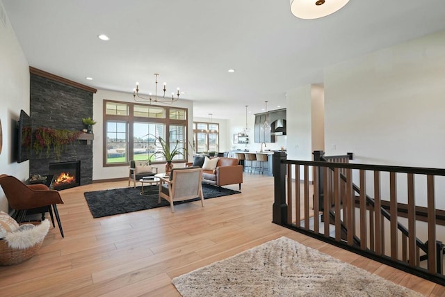 8437 Creek View Ln, Mount Pleasant, WI 53406 - living area featuring recessed lighting, a notable chandelier, light wood-style flooring, and a fireplace