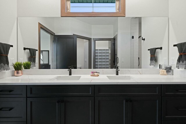 8437 Creek View Ln, Mount Pleasant, WI 53406 - full bathroom with a shower stall, a sink, and double vanity