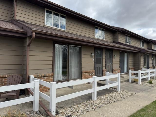 exterior space with fence private yard and brick siding