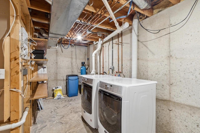 laundry area with laundry area and washer and clothes dryer