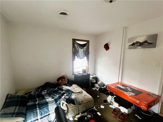 bedroom with visible vents and carpet floors