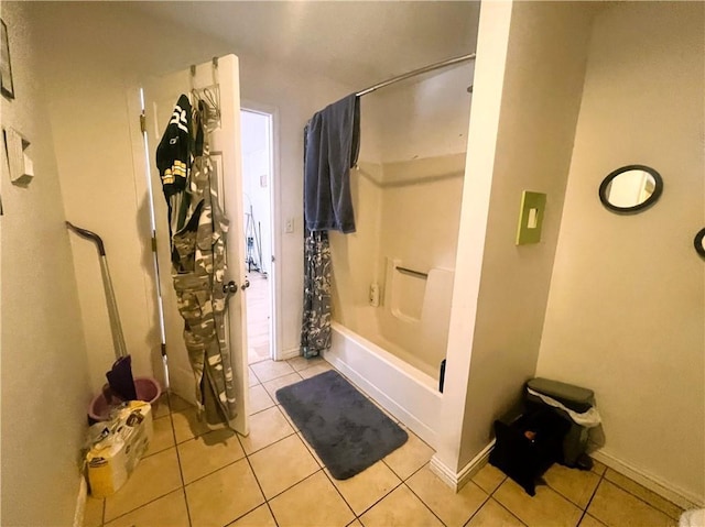 full bathroom featuring shower / bath combination with curtain and tile patterned flooring