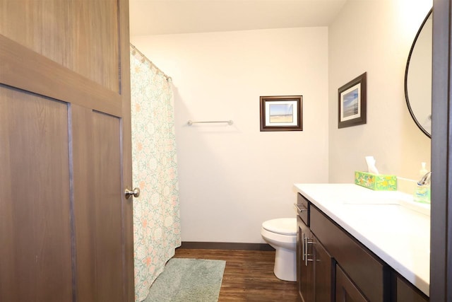 4365 Lakeland Dr, Oshkosh, WI 54904 - full bathroom featuring baseboards, wood finished floors, toilet, and vanity