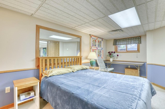 bedroom featuring carpet floors, visible vents, and baseboards