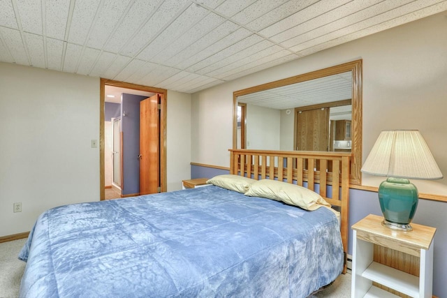carpeted bedroom with baseboards