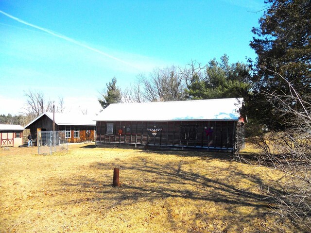 rear view of house with a lawn