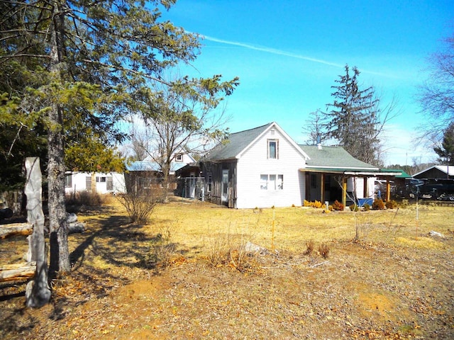 view of side of home with fence