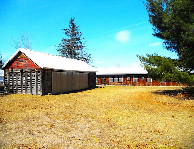 exterior space featuring an outdoor structure and an outbuilding