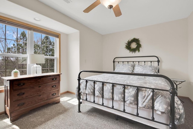 bedroom with carpet flooring, ceiling fan, and baseboards